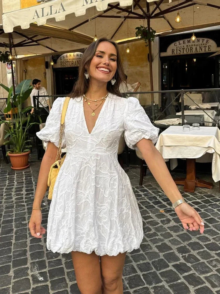 White Dress with Embroidered Ruffles and Sleeveless Design