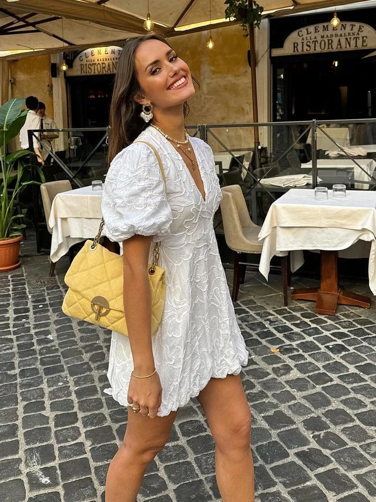 White Dress with Embroidered Ruffles and Sleeveless Design