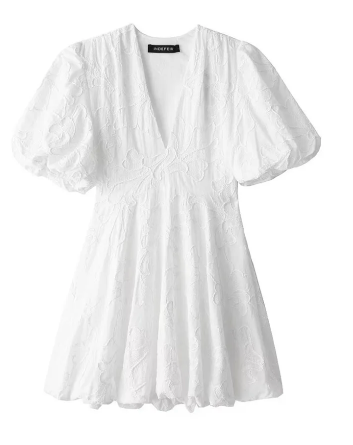 White Dress with Embroidered Ruffles and Sleeveless Design