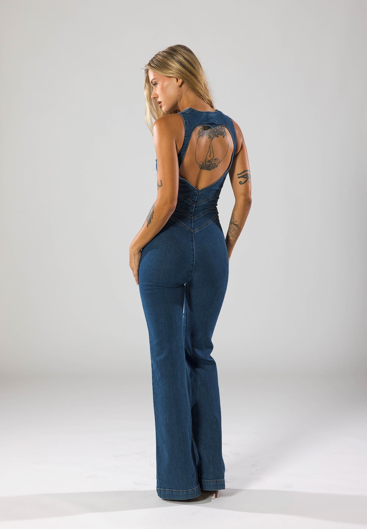 Women's Denim Jumpsuit with Deep V-Neck and Flared Leg Design