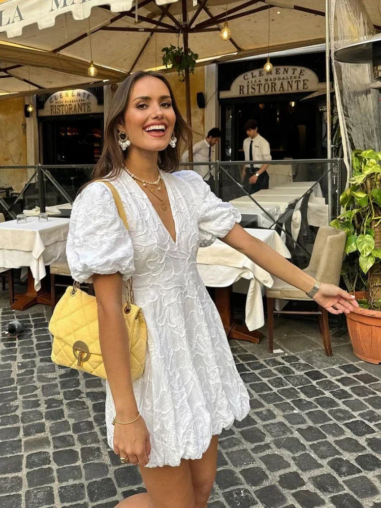 White Dress with Embroidered Ruffles and Sleeveless Design