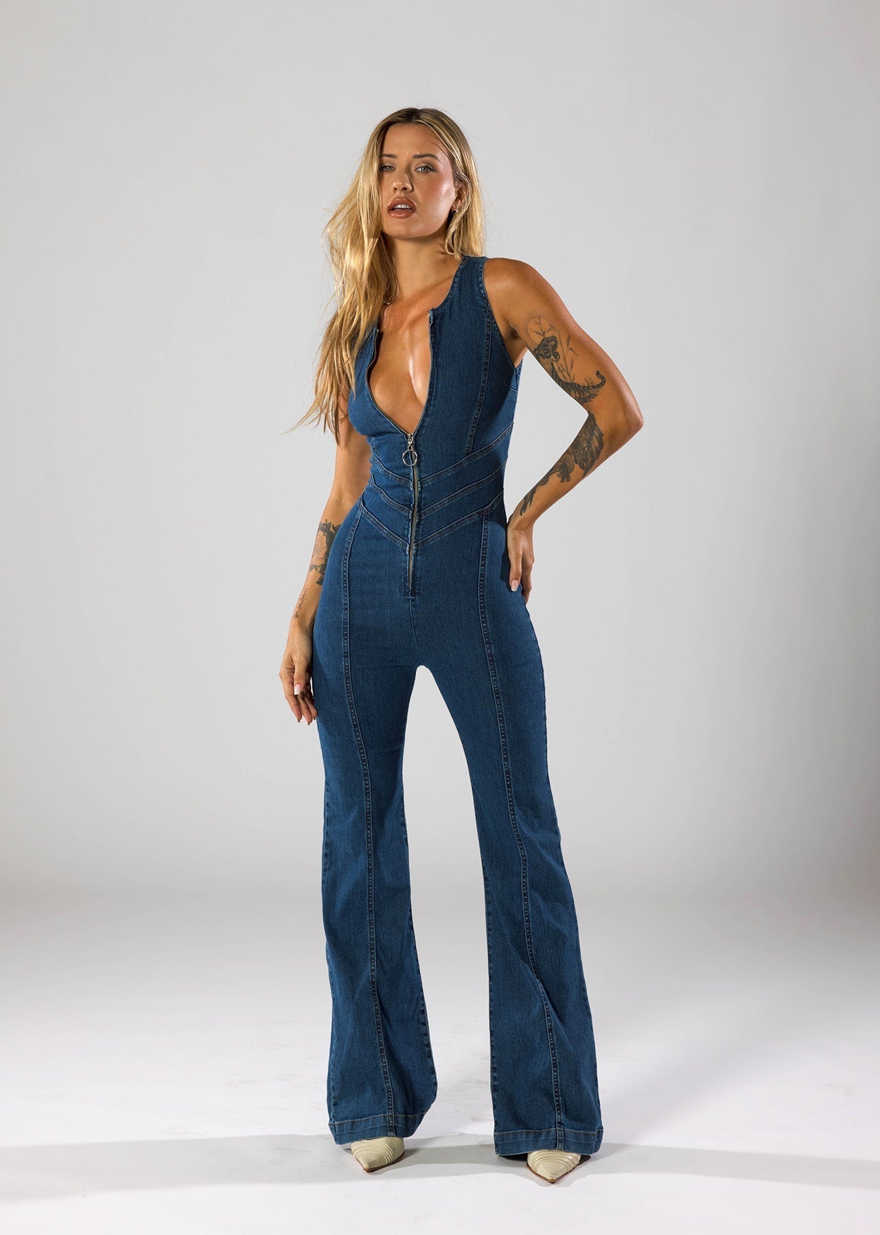 Women's Denim Jumpsuit with Deep V-Neck and Flared Leg Design